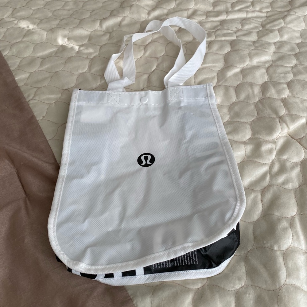 Lululemon Tote with snap closure in white.  New.